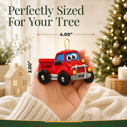 Size guide: the personalized pickup truck christmas ornament shown in hand next to a Christmas tree