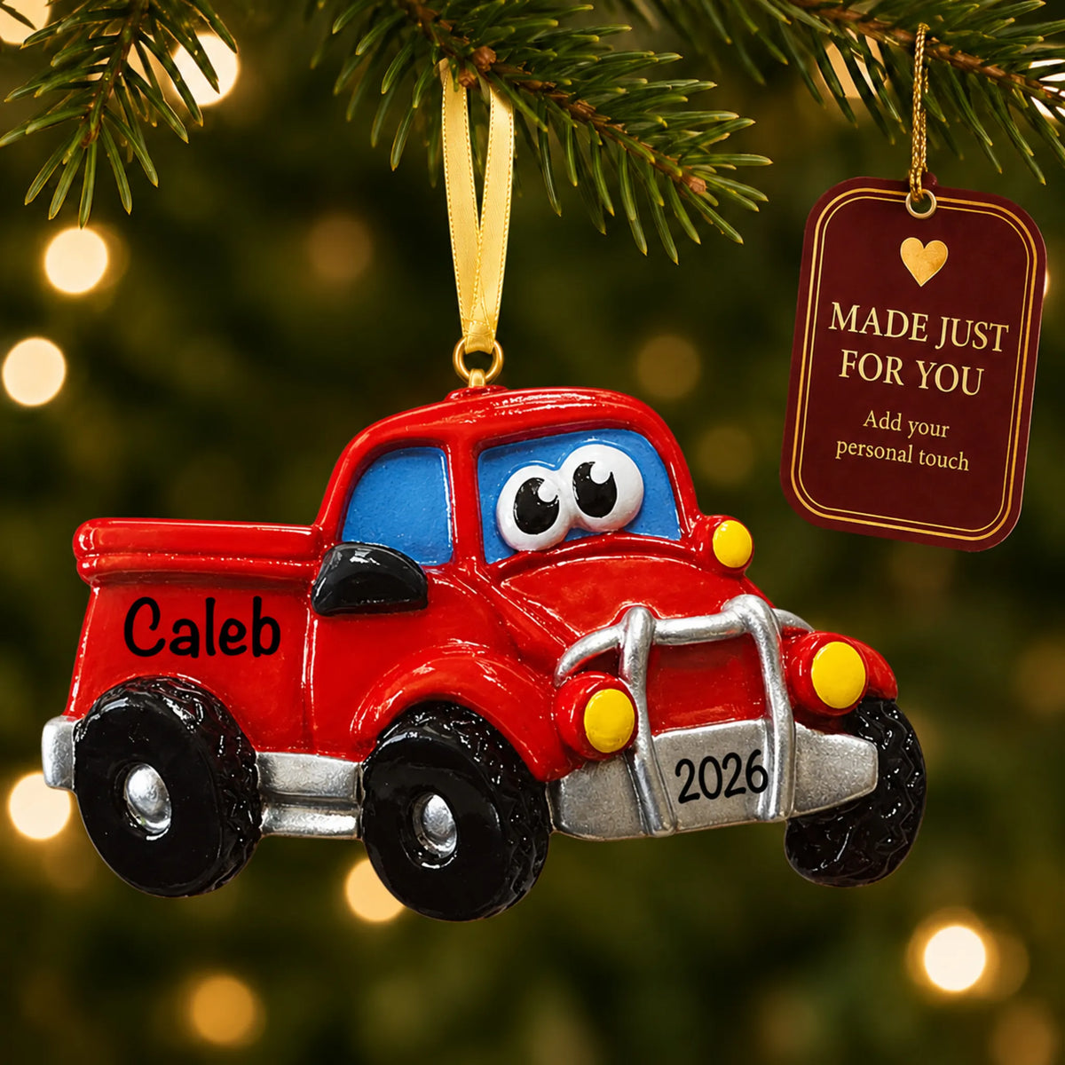 Pickup truck christmas ornament hanging on a lit Christmas tree with a Made Just For You gift tag