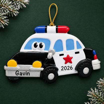 Personalized police car christmas ornament on a dark green pine background