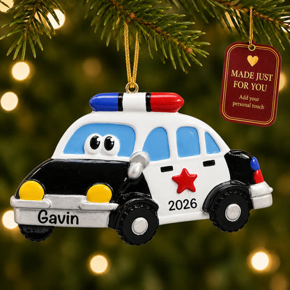 Police car christmas ornament hanging on a lit Christmas tree with a Made Just For You gift tag