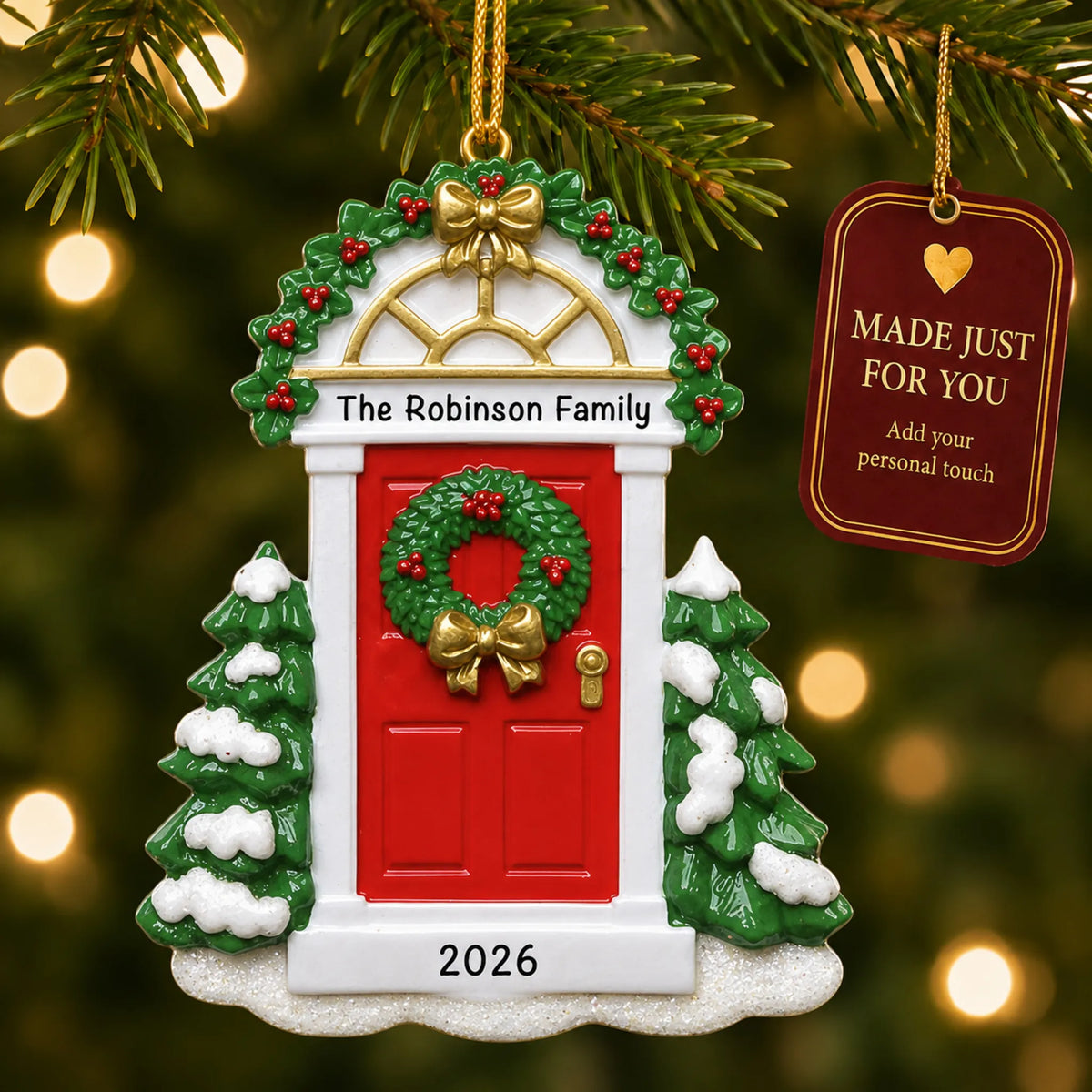 Red Door christmas ornament hanging on a lit Christmas tree with a Made Just For You gift tag