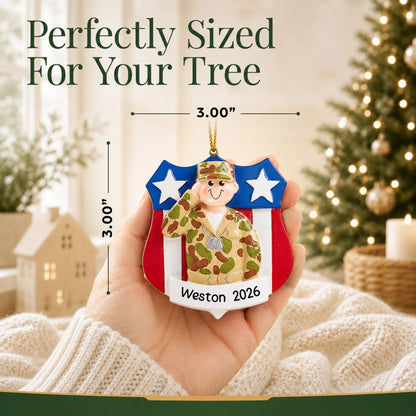 Personalized Army soldier USA shield Christmas ornament held in hand to show its size on the tree