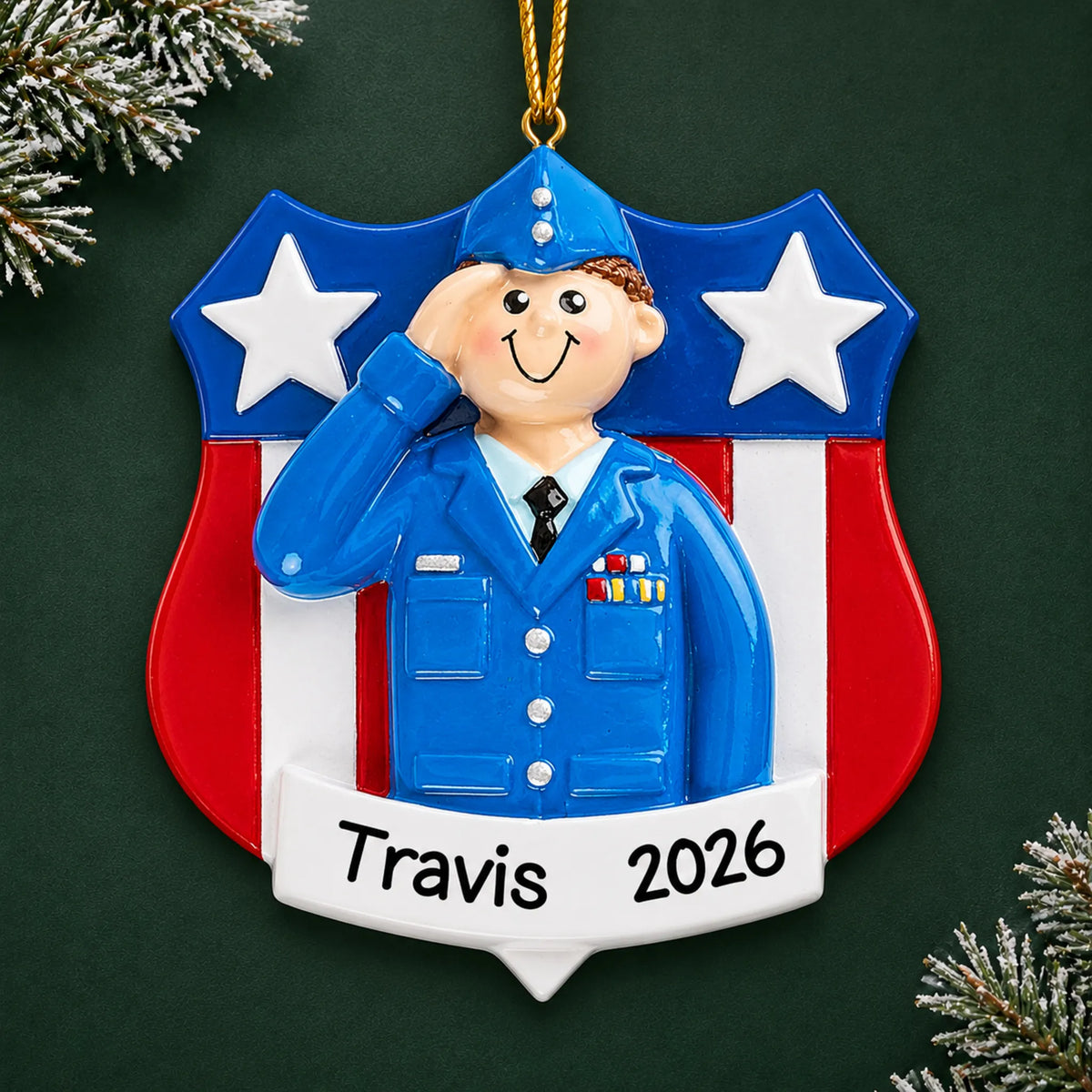 Personalized Air Force service member Christmas ornament with name and year, shown on a green holiday background