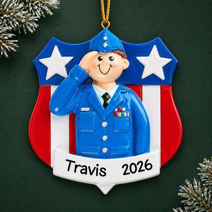 Personalized Air Force service member Christmas ornament with name and year, shown on a green holiday background