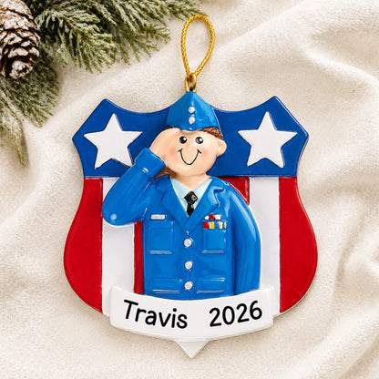 Personalized Air Force service member Christmas ornament shown on a soft white blanket