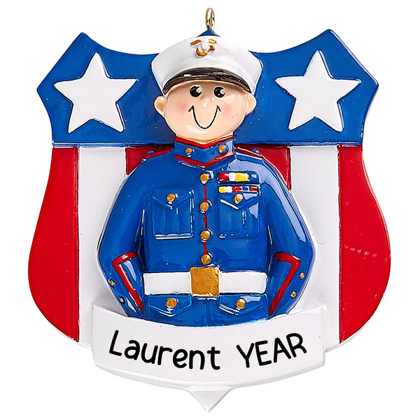 Personalized Christmas ornament featuring a male Marine Corps service member in a blue Dress Blues uniform with white cover, set against a red, white, and blue star shield, ready for custom name engraving.