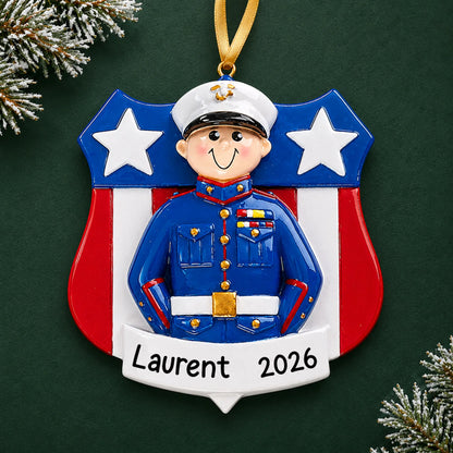 Personalized Marine Corps dress blues Christmas ornament with name and year, shown on a green holiday background
