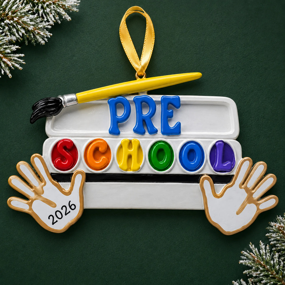 Personalized preschool Christmas ornament with name and year, shown on a green holiday background