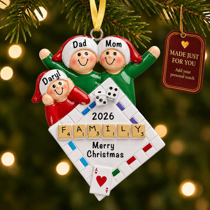 Game night family of 3 christmas ornament hanging on a lit Christmas tree with a Made Just For You gift tag