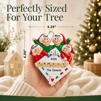 Size guide: the personalized game night family of 4 christmas ornament is 3.25 in wide by 4.00 in tall, shown in hand