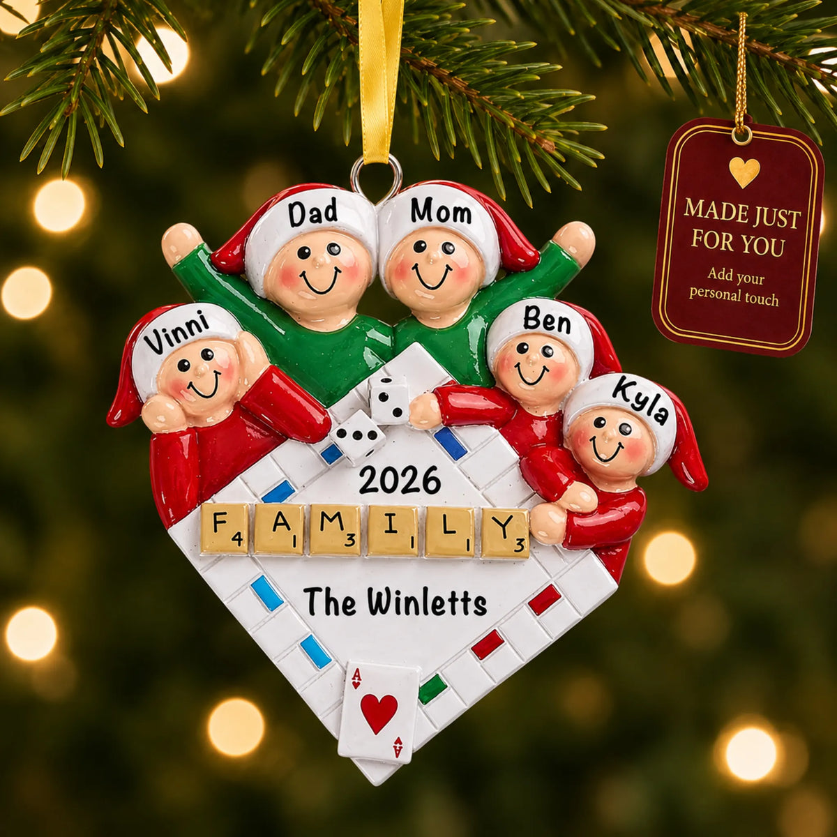 Game night family of 5 christmas ornament hanging on a lit Christmas tree with a Made Just For You gift tag