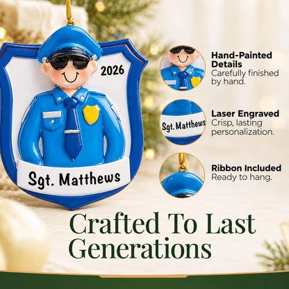 Hand-painted details and laser engraved personalization on the police officer guy christmas ornament, ribbon included