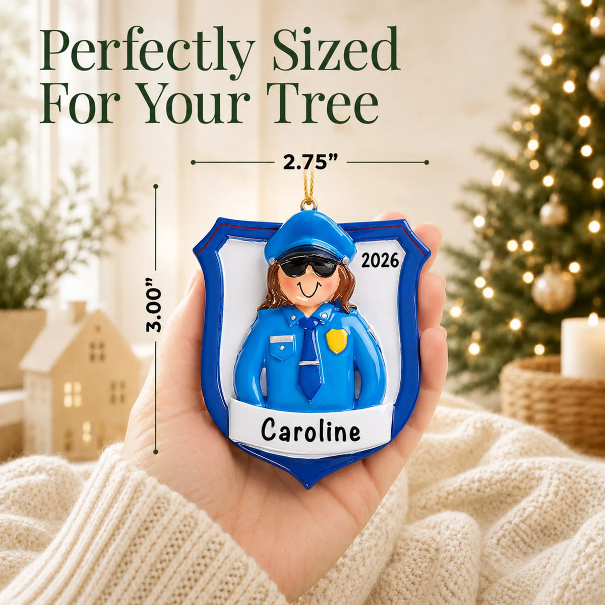 Size guide: the personalized police officer woman christmas ornament is 2.75 in wide by 3.00 in tall, shown in hand
