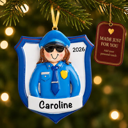 Police officer woman christmas ornament hanging on a lit Christmas tree with a Made Just For You gift tag