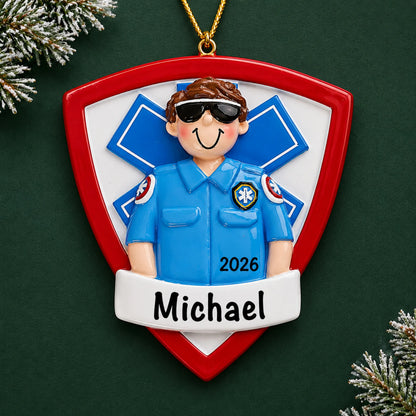 Personalized EMT paramedic christmas ornament on a dark green pine background