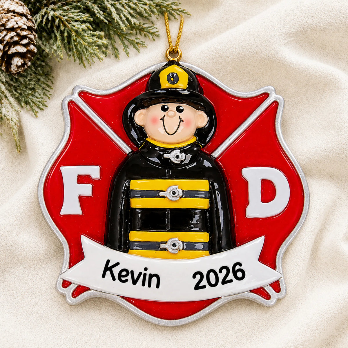 Personalized firefighter guy christmas ornament laid on a soft white knit blanket