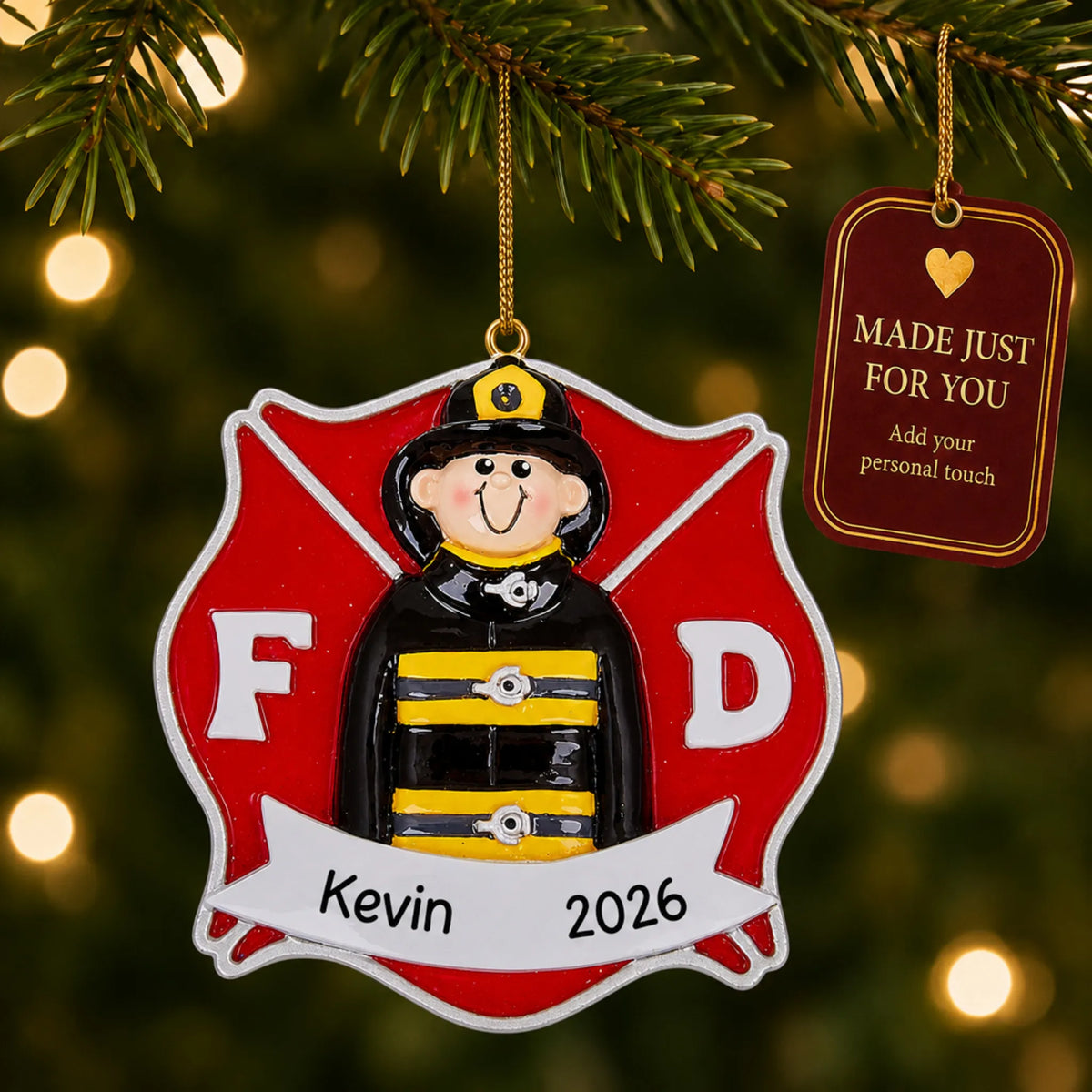 Firefighter guy christmas ornament hanging on a lit Christmas tree with a Made Just For You gift tag