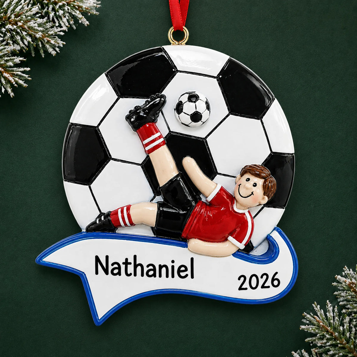 Personalized soccer kick boy christmas ornament on a dark green pine background