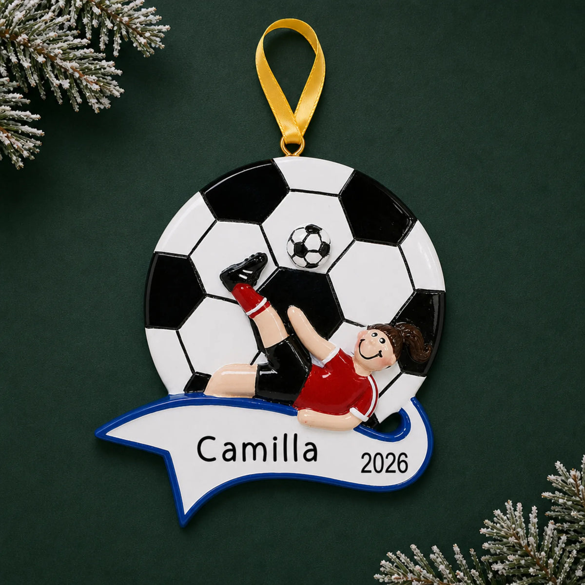 Personalized soccer kick girl christmas ornament on a dark green pine background