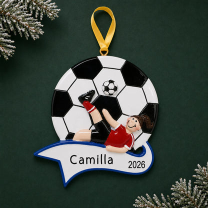 Personalized soccer kick girl christmas ornament on a dark green pine background