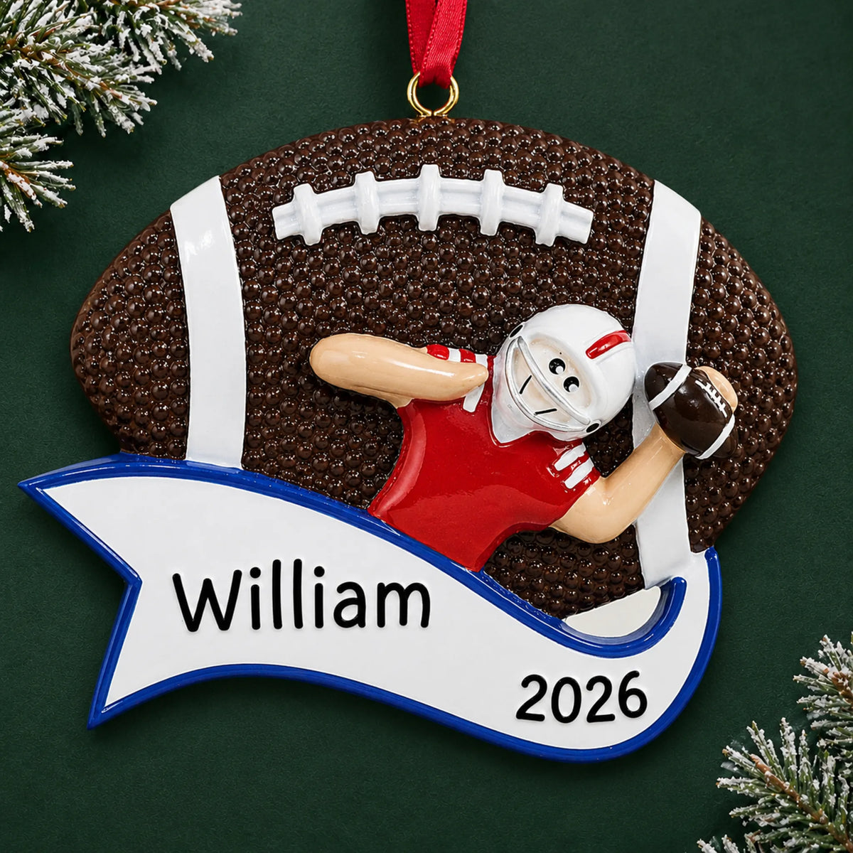 Personalized football quarterback christmas ornament on a dark green pine background