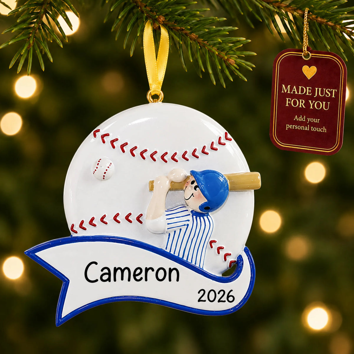 Baseball boy swing christmas ornament hanging on a lit Christmas tree with a Made Just For You gift tag