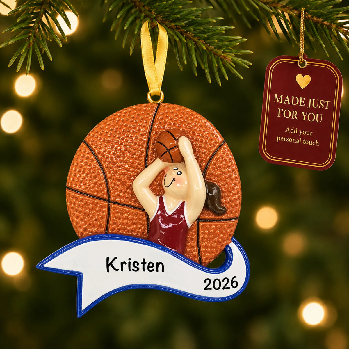 Basketball shot girl christmas ornament hanging on a lit Christmas tree with a Made Just For You gift tag