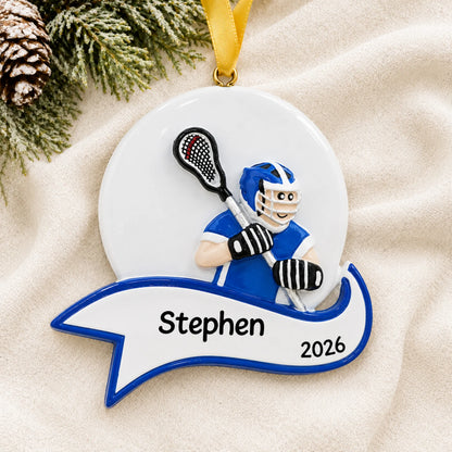 Personalized lacrosse shot boy christmas ornament laid on a soft white knit blanket