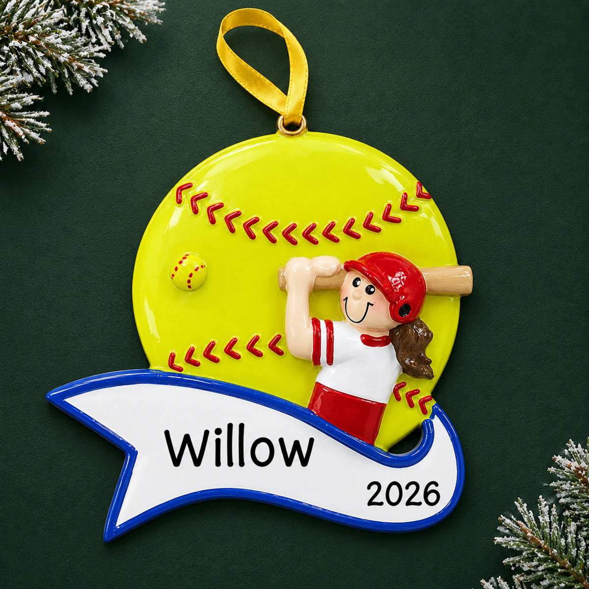 Personalized softball batter girl christmas ornament on a dark green pine background