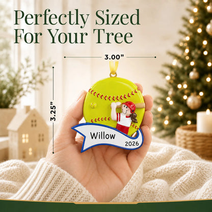Size guide: the personalized softball batter girl christmas ornament shown in hand next to a Christmas tree
