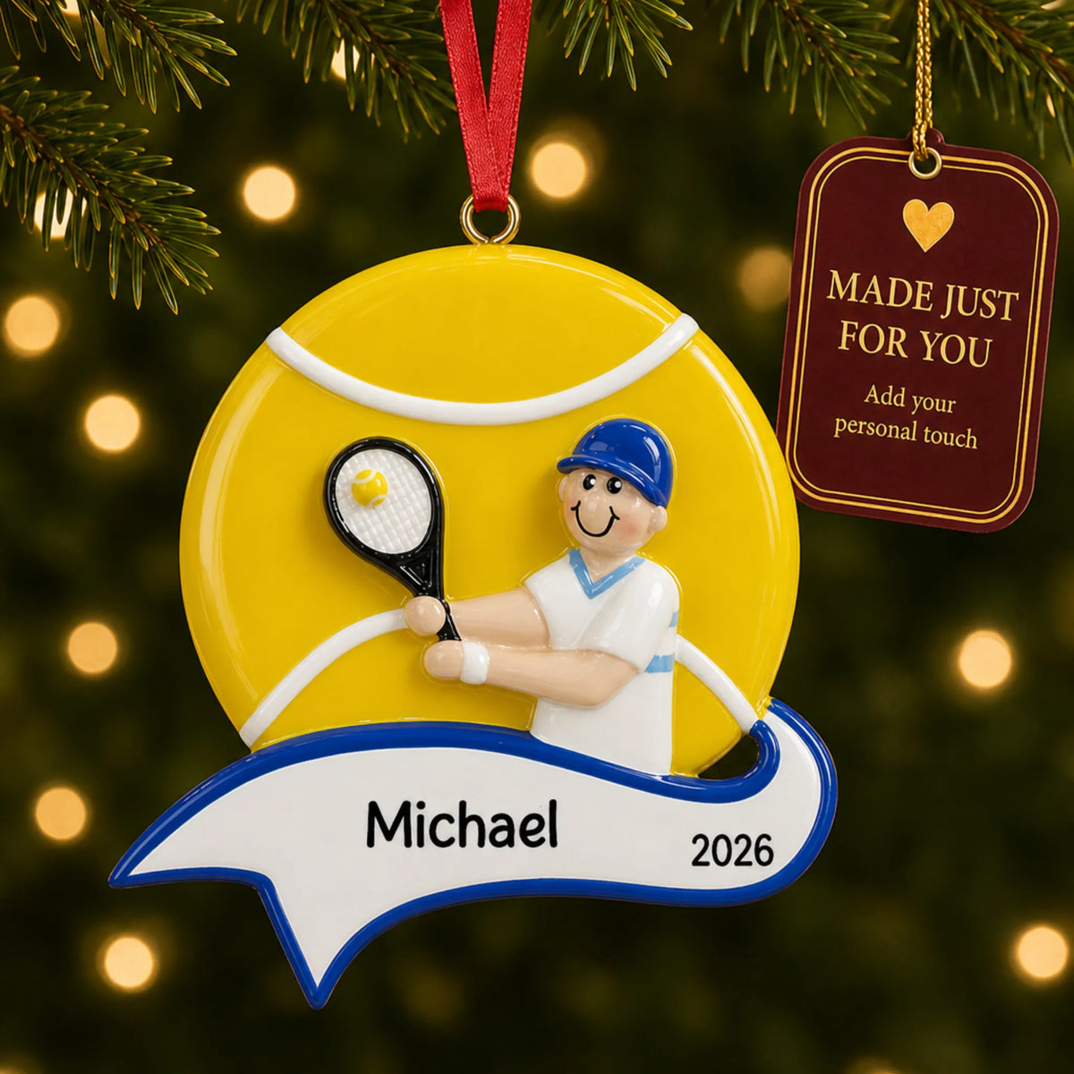 Tennis boy christmas ornament hanging on a lit Christmas tree with a Made Just For You gift tag