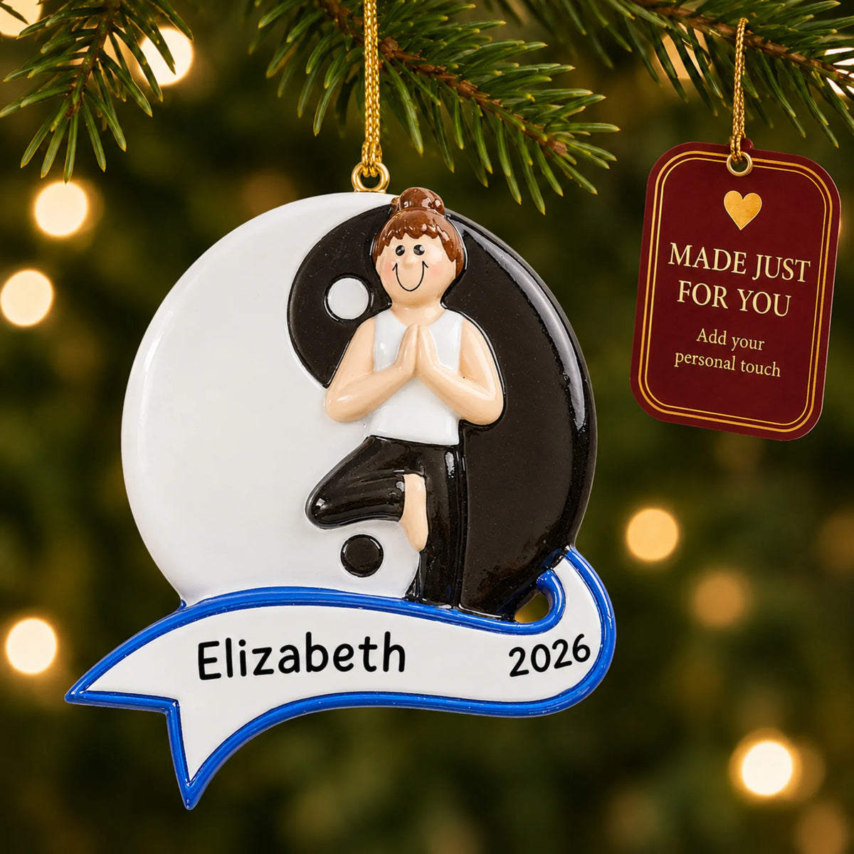 Yoga yin and yang christmas ornament hanging on a lit Christmas tree with a Made Just For You gift tag