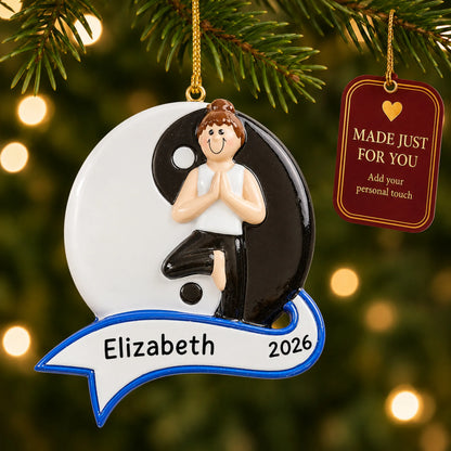 Yoga yin and yang christmas ornament hanging on a lit Christmas tree with a Made Just For You gift tag