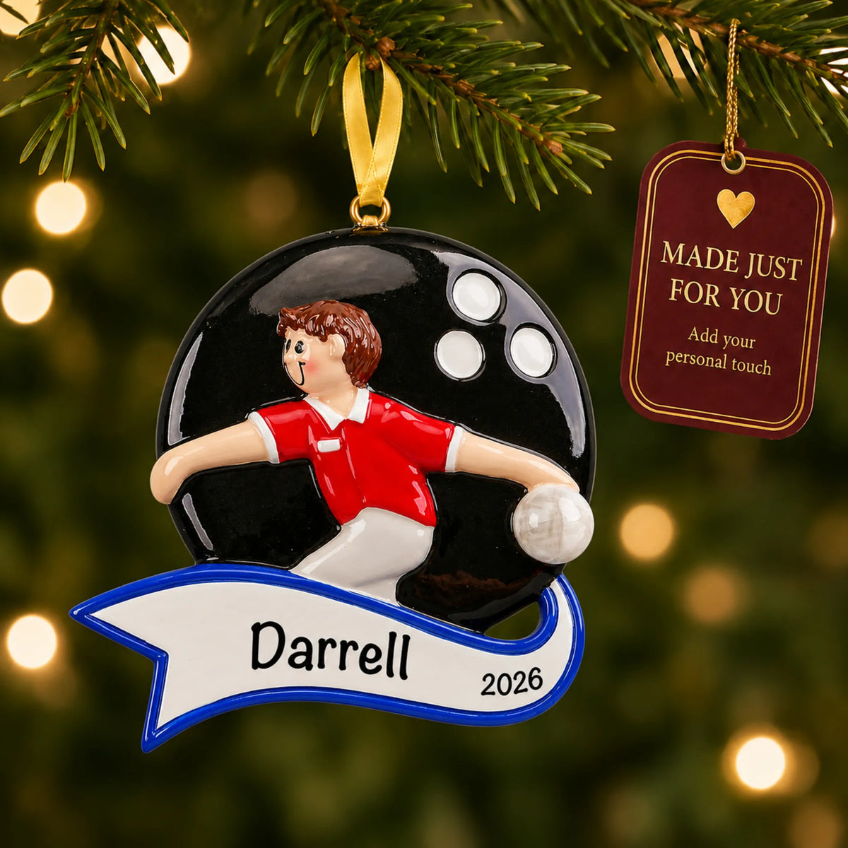 Bowling guy christmas ornament hanging on a lit Christmas tree with a Made Just For You gift tag