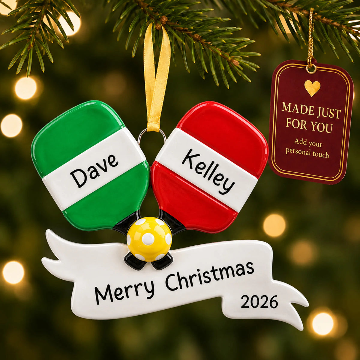Pickleball paddles christmas ornament hanging on a lit Christmas tree with a Made Just For You gift tag