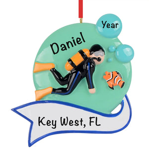 Personalized scuba diver Christmas ornament, a diver in a black wetsuit with an orange tank and fins, name engraved on the banner.