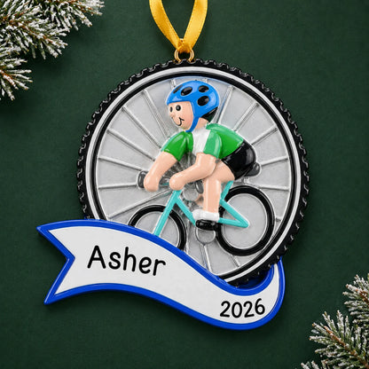 Personalized cycling boy christmas ornament on a dark green pine background