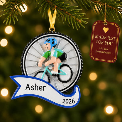 Cycling boy christmas ornament hanging on a lit Christmas tree with a Made Just For You gift tag