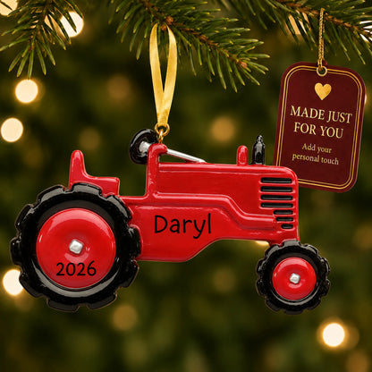 Red tractor christmas ornament hanging on a lit Christmas tree with a Made Just For You gift tag
