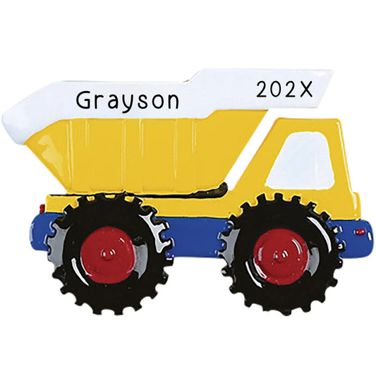 Personalized Christmas ornament shaped like a bright yellow and blue dump truck, with the name and the year engraved on the white truck bed.