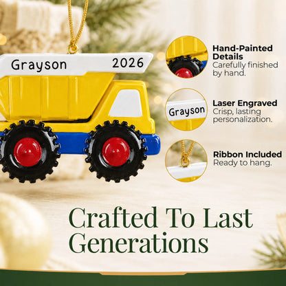 Hand-painted details and laser engraved personalization on the yellow kids dump truck christmas ornament, ribbon included