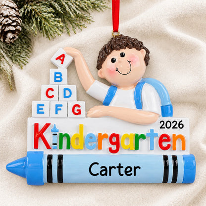 Personalized kindergarten boy Christmas ornament shown on a soft white blanket