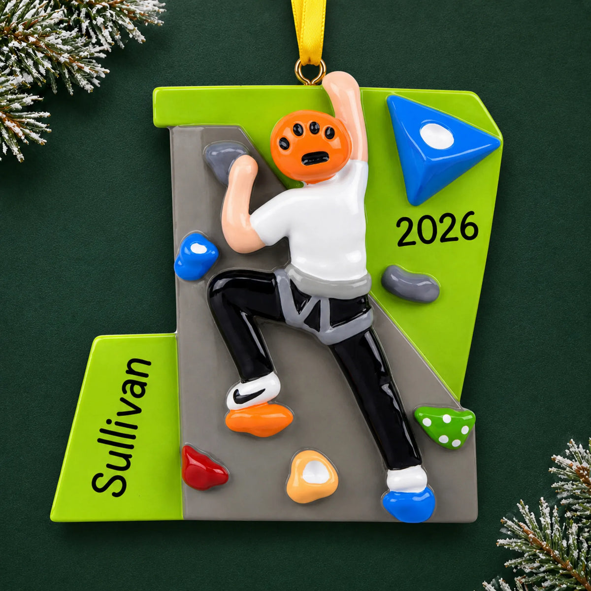 Personalized rock climber guy christmas ornament on a dark green pine background