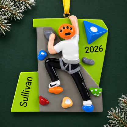 Personalized rock climber guy christmas ornament on a dark green pine background