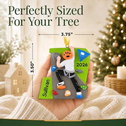 Size guide: the personalized rock climber guy christmas ornament shown in hand next to a Christmas tree