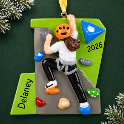 Personalized girl rock climber christmas ornament on a dark green pine background