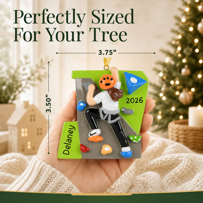 Size guide: the personalized girl rock climber christmas ornament shown in hand next to a Christmas tree
