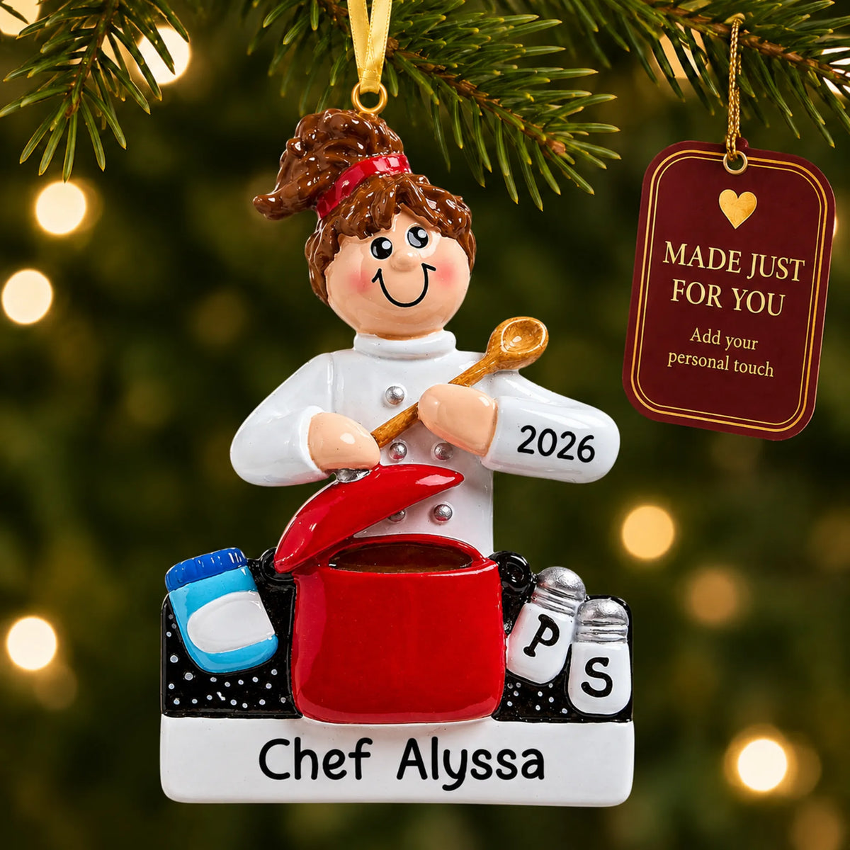 Chef christmas ornament hanging on a lit Christmas tree with a Made Just For You gift tag