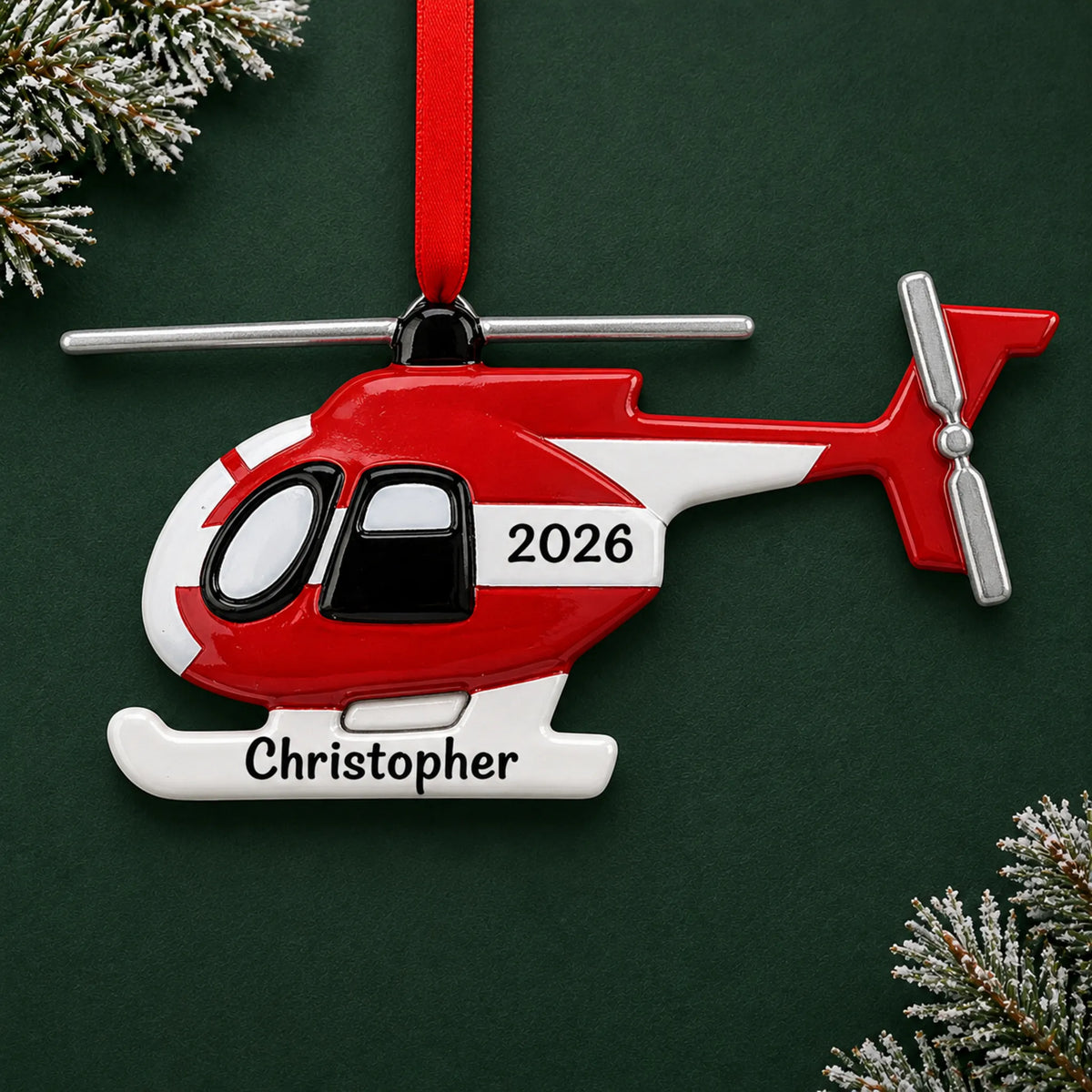 Personalized helicopter christmas ornament on a dark green pine background