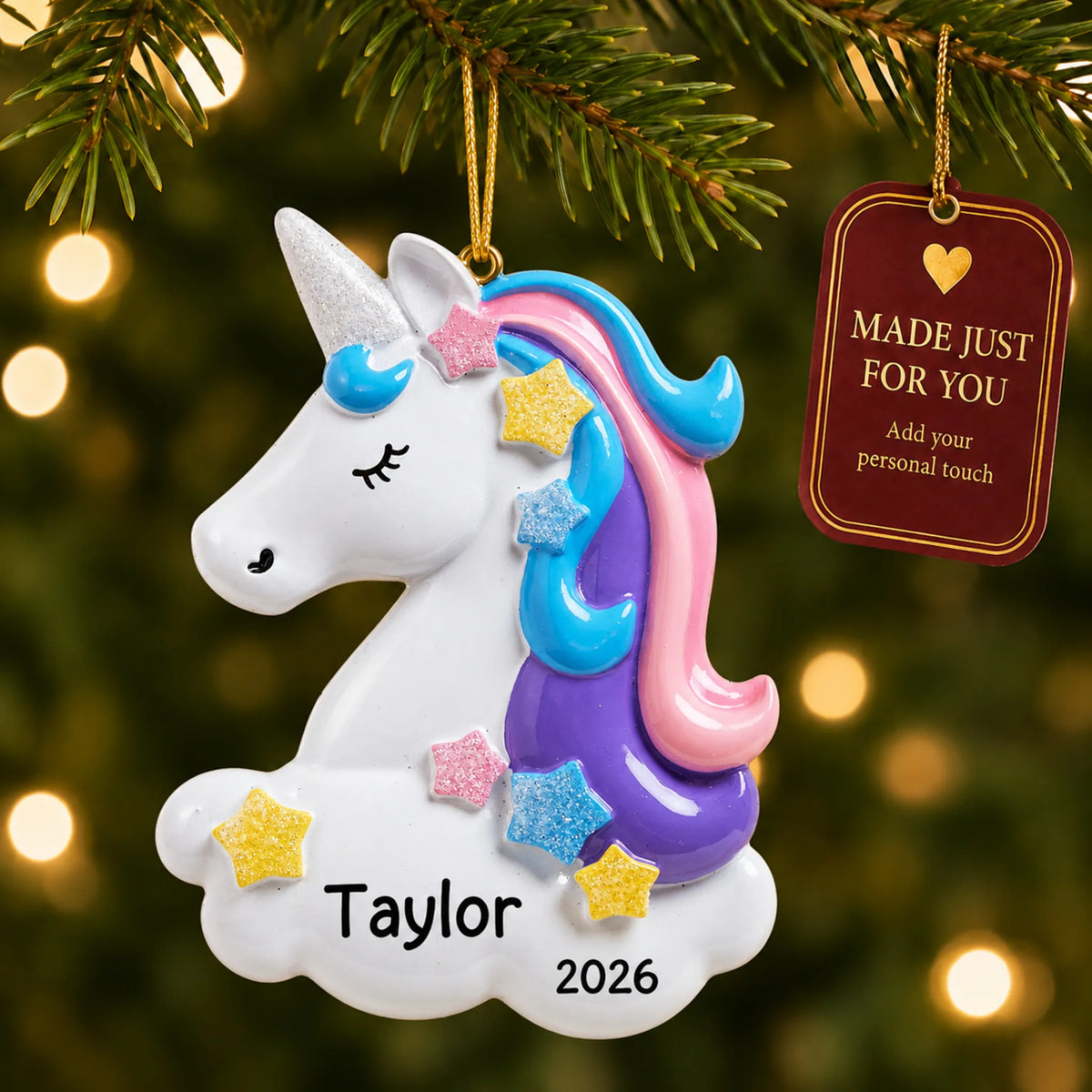 Unicorn christmas ornament hanging on a lit Christmas tree with a Made Just For You gift tag